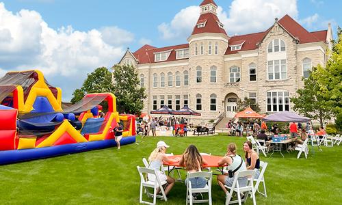 A photograph of a party on Main Lawn from the cover of the fall, 2022, issue of First magazine